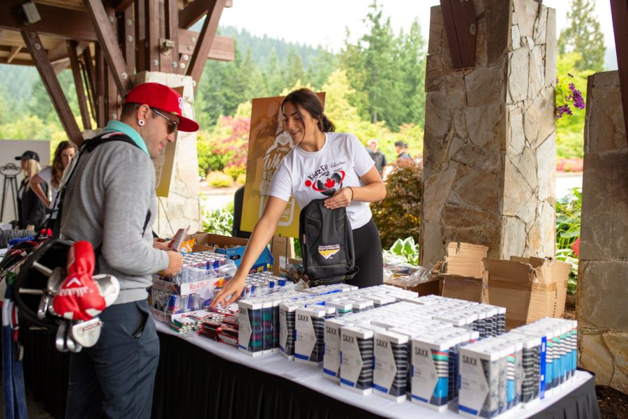 Players checking out SAXX sponsors table the Whiskey Wisemen Charity Tournament at Westwood Plateau Golf Club