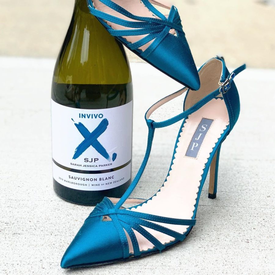 EcoLuxlifestyle showcases Blue Sarah Jessica Parker shoes with Invivo wine bottle